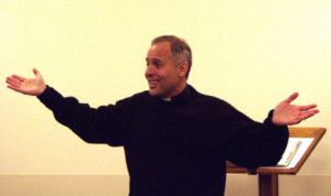 Fr. James DiLuzio proclaiming the Gosple of Luke